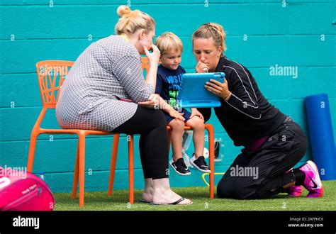 Victoria Azarenka of Belarus warms up for her doubles match with son ...