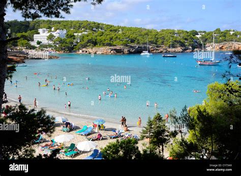 View Of Cala Portinatx In Ibiza Full Of Tourists And Boats Stock Photo