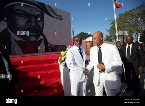 Haiti S President Michel Martelly Greets Haiti S Prime Minister Evans Paul Upon His Arrival To