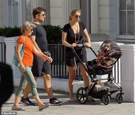 Rachel Riley heads out for a stroll with Pasha Kovalev and their baby ...