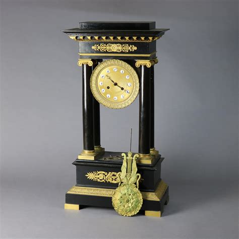 Antique French Empire Ebonized And Gilt Portico Mantel Clock Circa