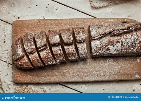 Freshly Baked Bread Top View Of Sliced Wholegrain Bread On Dark Ructic Wooden Background