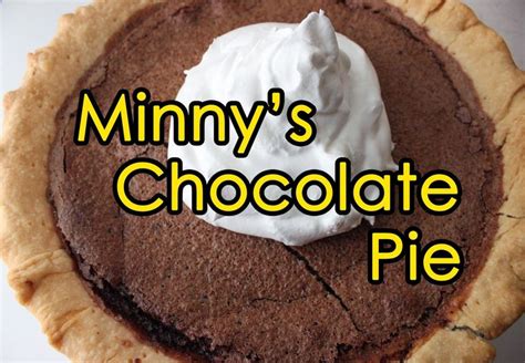 A Chocolate Pie With Whipped Cream On Top And The Words Minny S