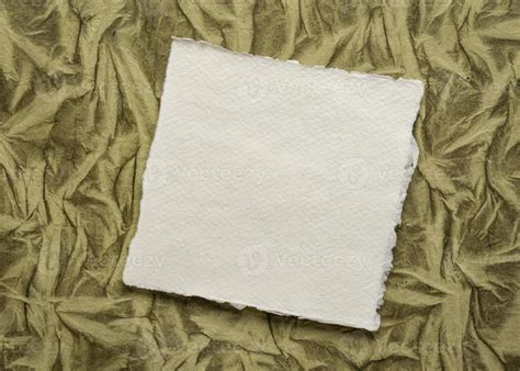 Small Sheet Of Blank White Khadi Rag Paper Against Art Paper Background