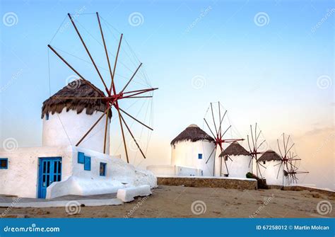 Traditional Greek Windmills On Mykonos Island At Sunrise Cyclades