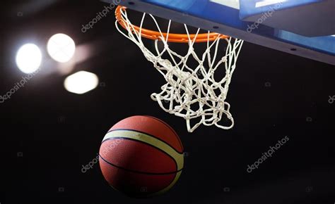 Basketball Going Through The Hoop At A Sports Arena Stock Photo By