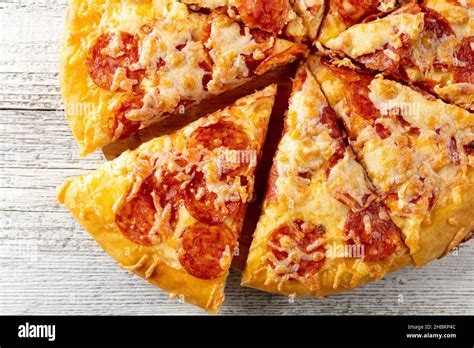 Tasty Hot Homemade Pepperoni Pizza On White Wooden Background