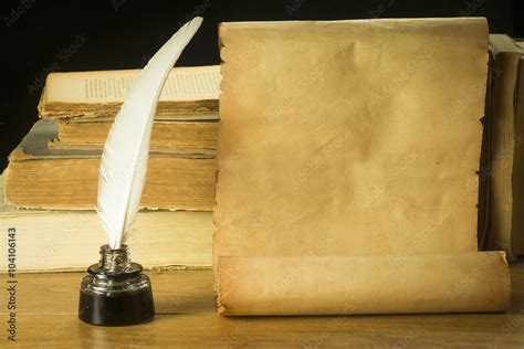 Scroll Of Old Paper For Background Old Books Inkwell And Pen Stock