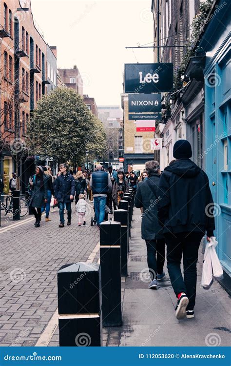 People Walking On A Pavement In Covent Garden London Uk Editorial