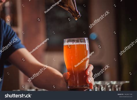 Bartender Pouring Beer Glass Bar Counter Stock Photo 1462821185