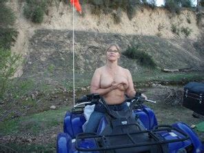 Outdoors Holding Up Boobs On Quad Porn Pic