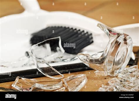 Remnants Pile Of Broken Glass On Floor After Accident And Glass Slipped Out Of Wet Hands Knocked