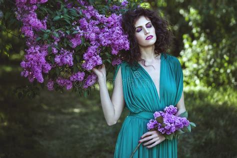 Woman In The Alley Of Lilac Bushes In The Garden Stock Image Image