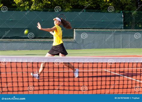 Professional Equipped Female Tennis Player Beating Hard The Tennis Ball