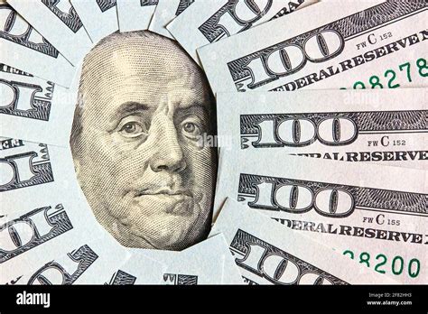 A Lot Of Folded One Hundred 100 Usd Bills Layed Like Vintage Sun Face Beams Around Benjamin