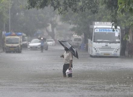 Vehicles Drive Through Water Logged Street Editorial Stock Photo