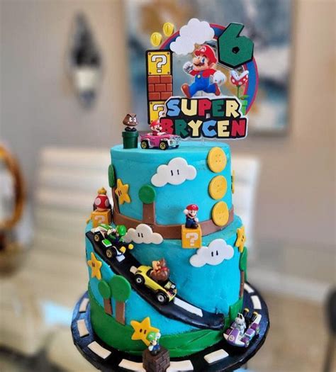 A Birthday Cake Decorated With Mario And His Friends