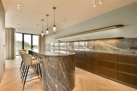 Premium Photo A Kitchen With Marble Countertops And Bar Stools