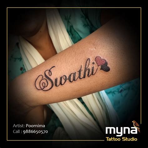 A Woman S Arm With The Word Squatti On It And Two Hearts In Black Ink