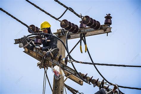 Electrician Working On The Electricity Pole Dangerous Renovate Engineer ...