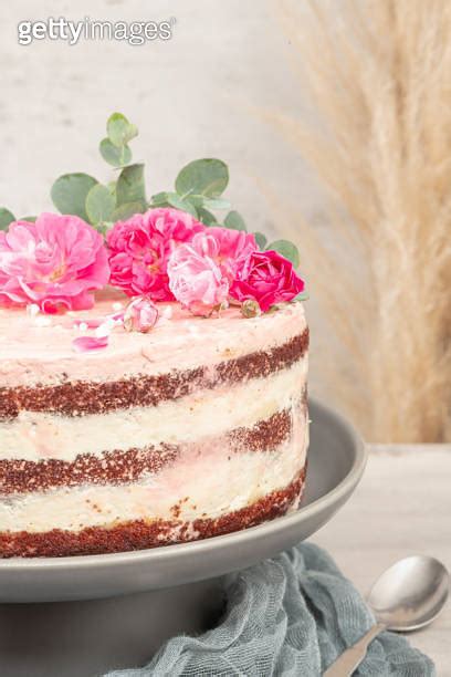 Red Velvet Naked Cake With Fresh Roses And Swiss Buttercream On Kitchen