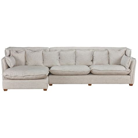 A White Couch With Pillows On It