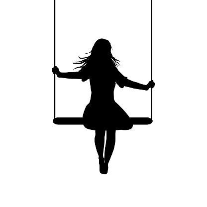 A Woman Sitting On A Swing With Her Hair Blowing In The Wind