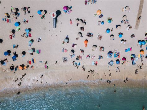 Drone View Of People At Beach stock photo