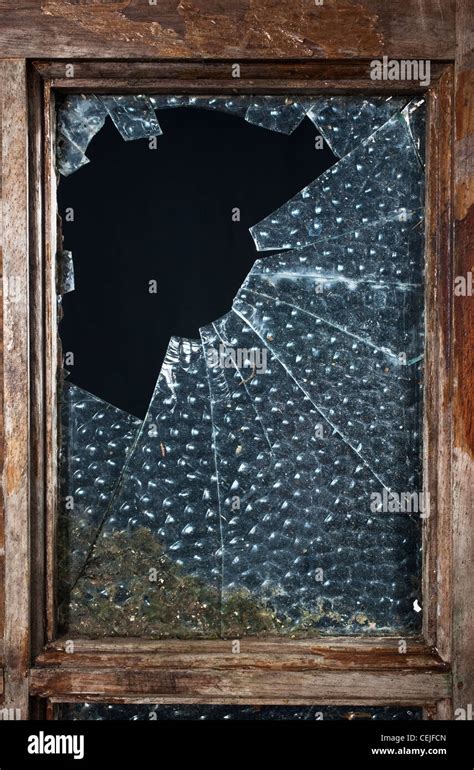 A broken glass window pane Stock Photo - Alamy