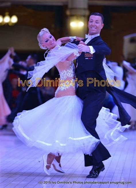 Two People Dressed In Formal Wear Dancing On A Dance Floor