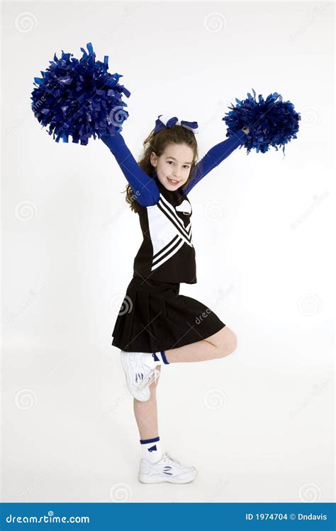 Nine Year Old Caucasian Girl Dressed In A Blue Cheerleader Outfit Stock