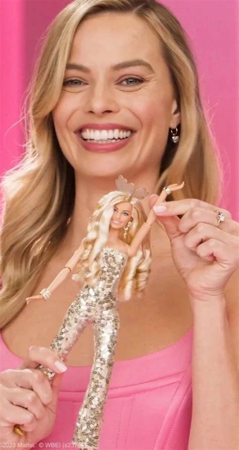 Margot Robbie As Barbie With Her Barbie Doll Doing Press For The Barbie