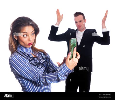 Young Corporate Woman Makes Selfie With Mobile Phone While Man In Black