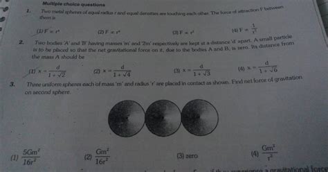 Three Uniform Spheres Each Of Mass M And Radius R Are Placed In C