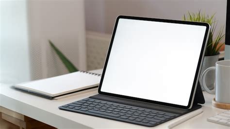 Premium Photo White Screen Tablet With Smart Keyboard On Workspace Desk