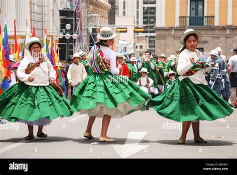 Bolivian People In Colorful Traditional Costumes Celebrating The