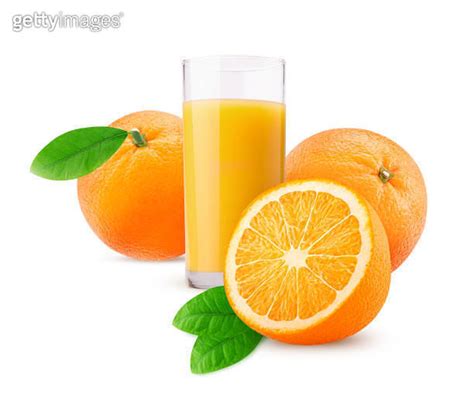 Glass Of Freshly Squeezed Orange Juice And Two Orange One Cut In Half