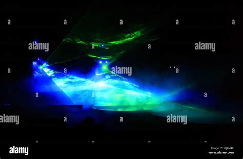 a laser light effect in a performance Stock Photo - Alamy