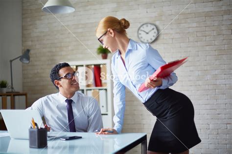 Charming Secretary Talking To Her Boss At Meeting Royalty Free Stock Image Storyblocks