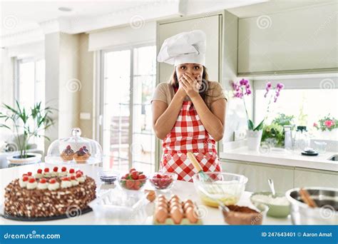 Beautiful Young Brunette Pastry Chef Woman Cooking Pastries At The Kitchen Shocked Covering