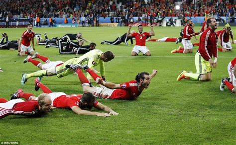 Wales Team Celebrate Historic Euro 2016 Victory Over Belgium By Leading