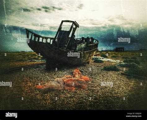 Abandoned Wreck Of Old Wooden Fishing Boat On Dungeness Shingle Spit