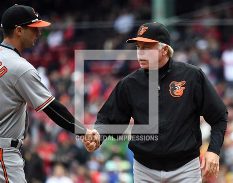 Baltimore Orioles manager, BUCK SHOWALTER, shakes hands with center ...