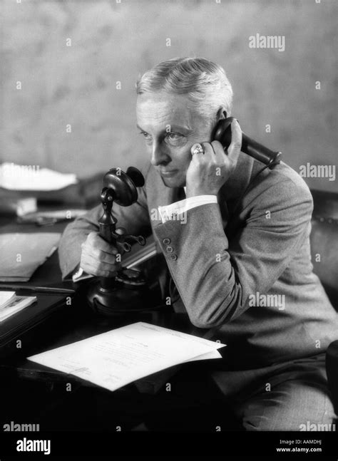 1920s Businessman At Desk Talking On Candlestick Phone Stock Photo Alamy