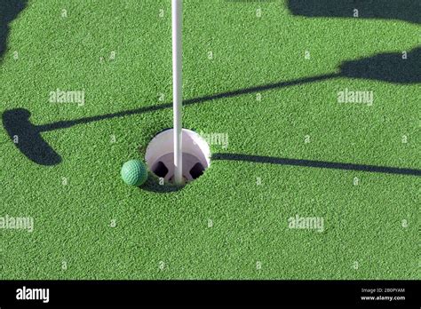 Mini Golf Club Ball And Hole Stock Photo Alamy