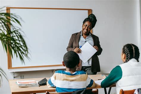 Black Teacher With Kids In Modern Classroom · Free Stock Photo