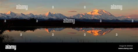 Alpenglow On Mt Mckinley Also Known As Denali Reflected In Tundra