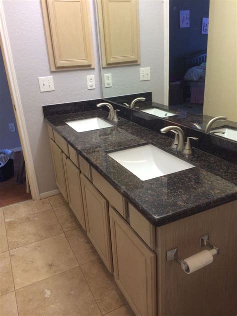 Elegant Bathroom Remodel with Travertine and Tan Brown Granite