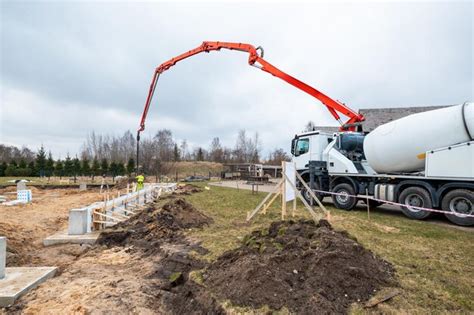 Premium Photo | Construction Worker Precisely Operating Concrete Pump ...