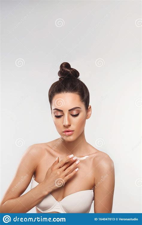 Beauty Concept Woman Applying Cosmetics Cream And Smiling Stock Image